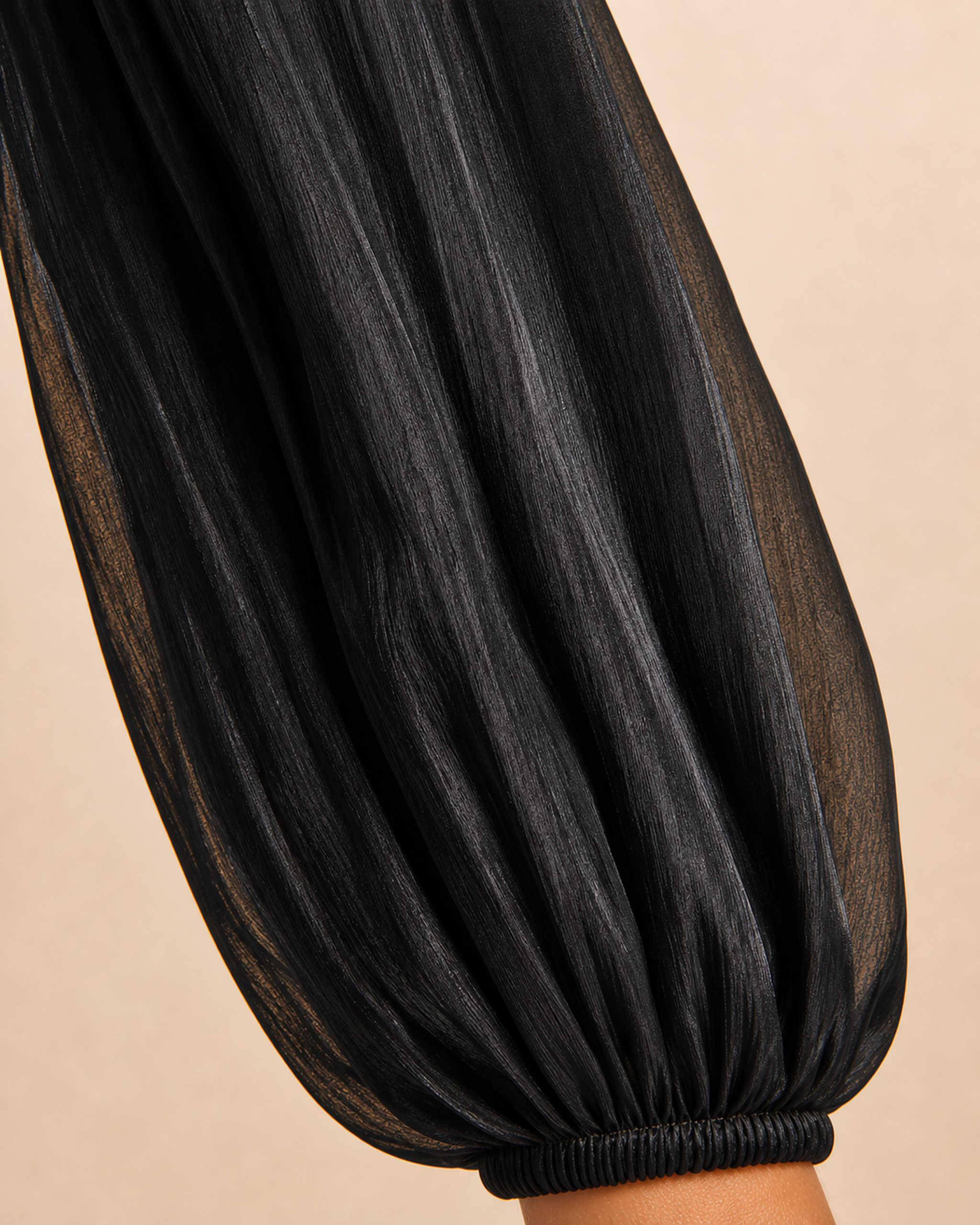 Close-up of the Layla abaya fabric showing its soft satin sheen and lightly sheer drape