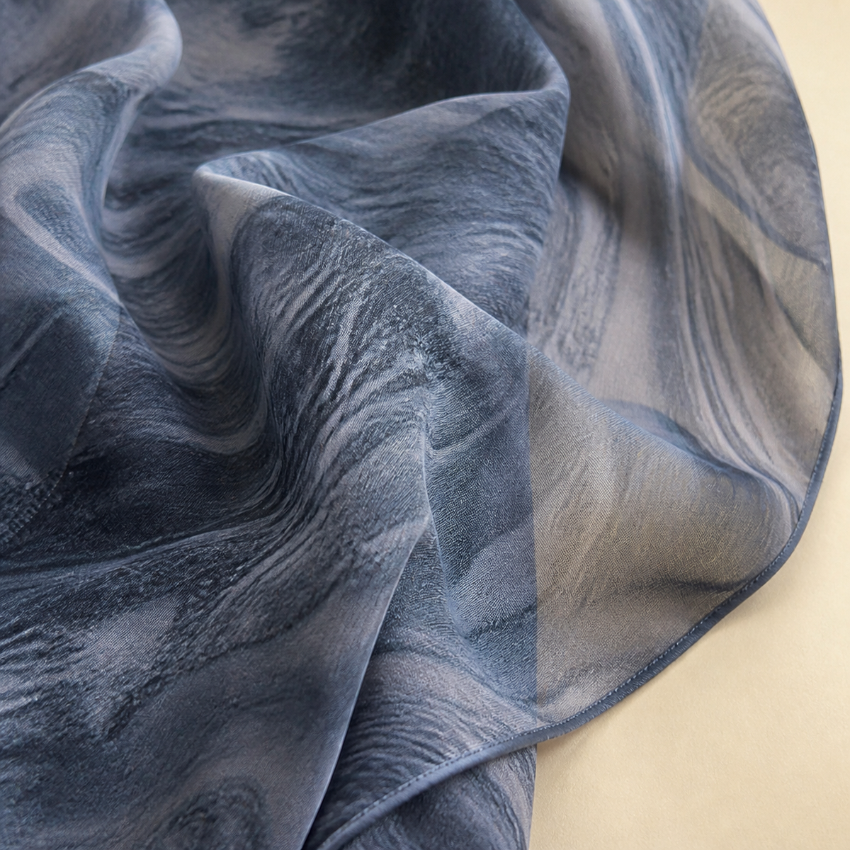 Close-up of the marbled watercolour print on the Sama abaya's semi-sheer chiffon