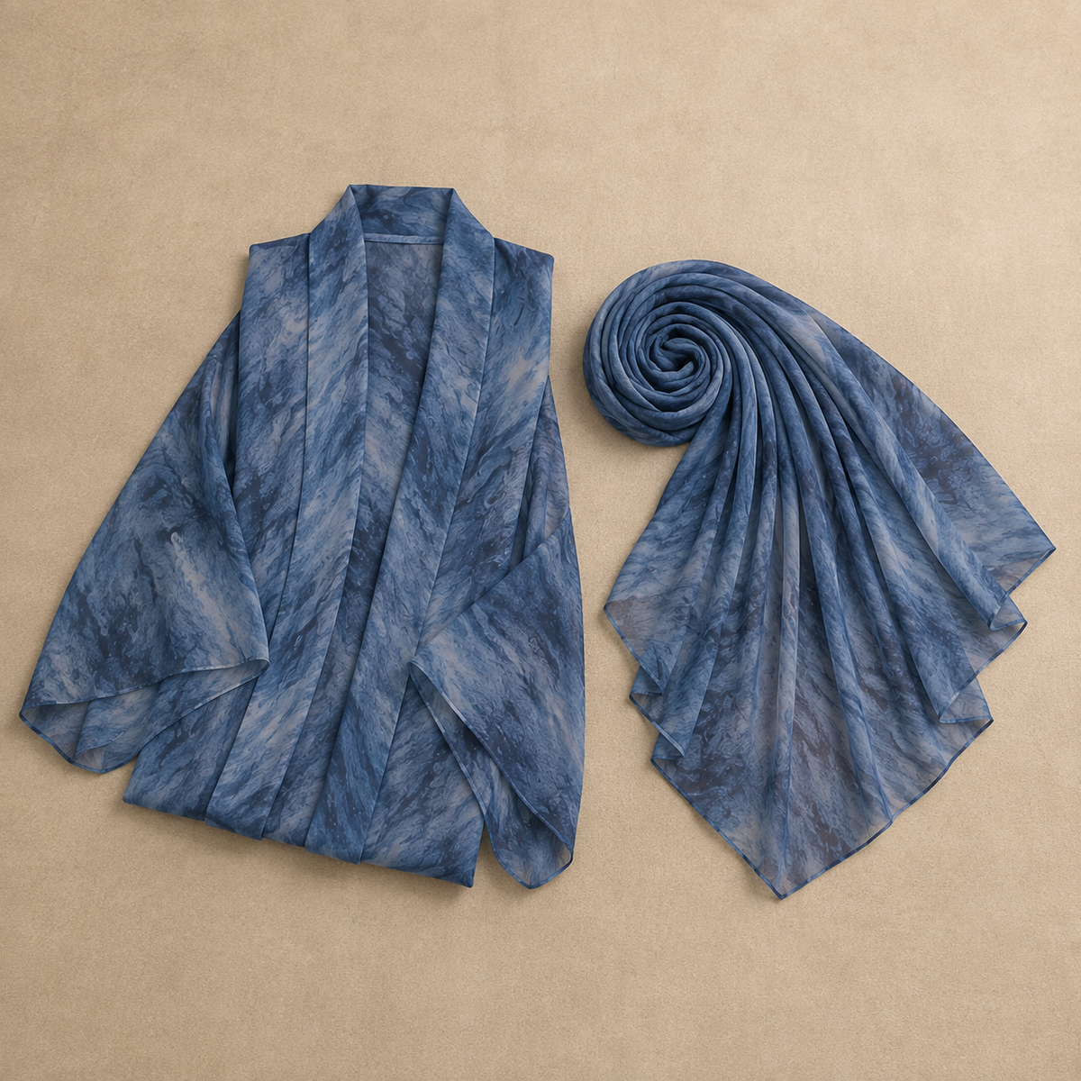 Flat-lay of the folded Sama abaya in Blue with its matching printed shayla — what's in the parcel
