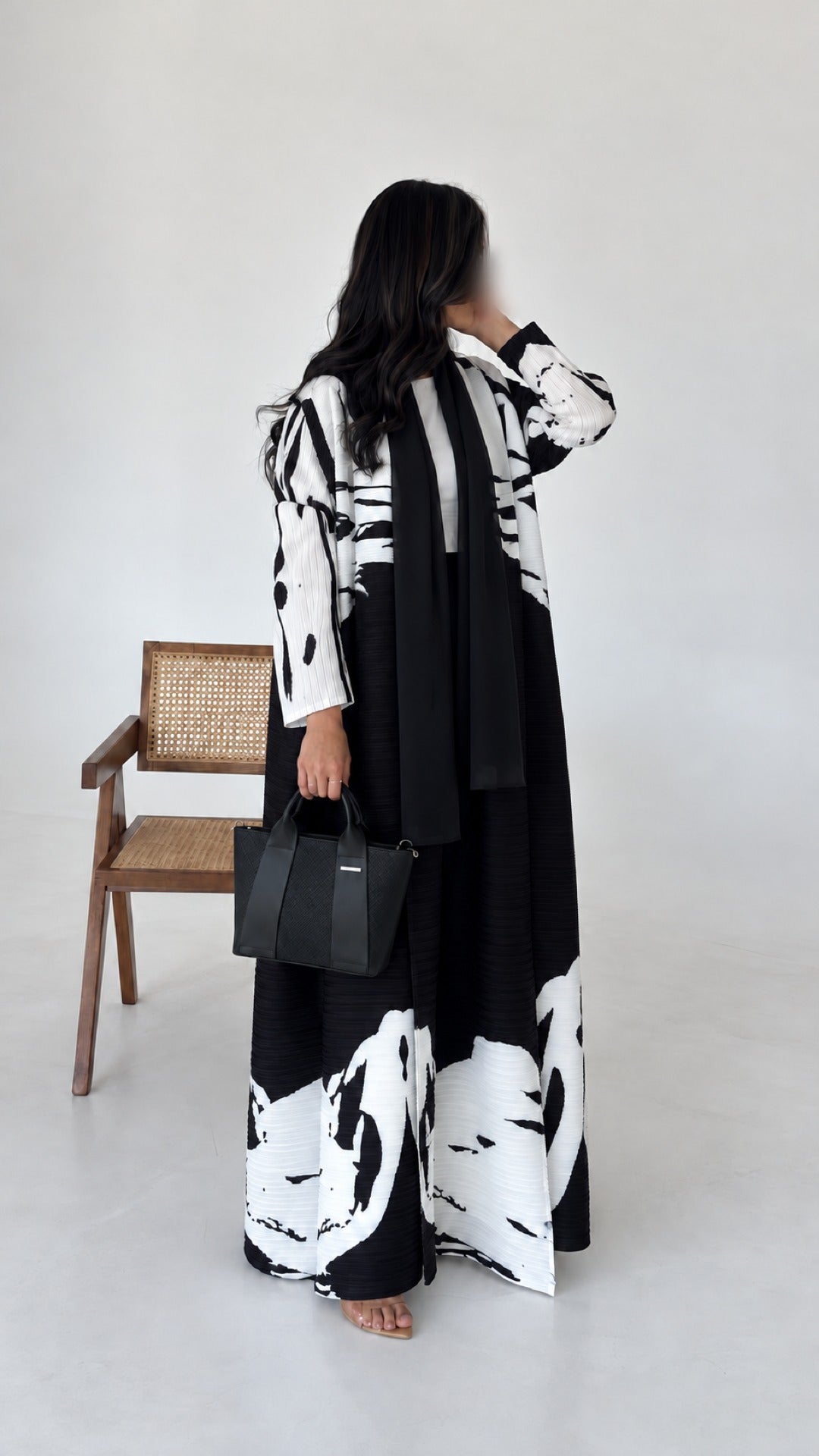 Reem Top-Handle Bag in black, full-length studio shot