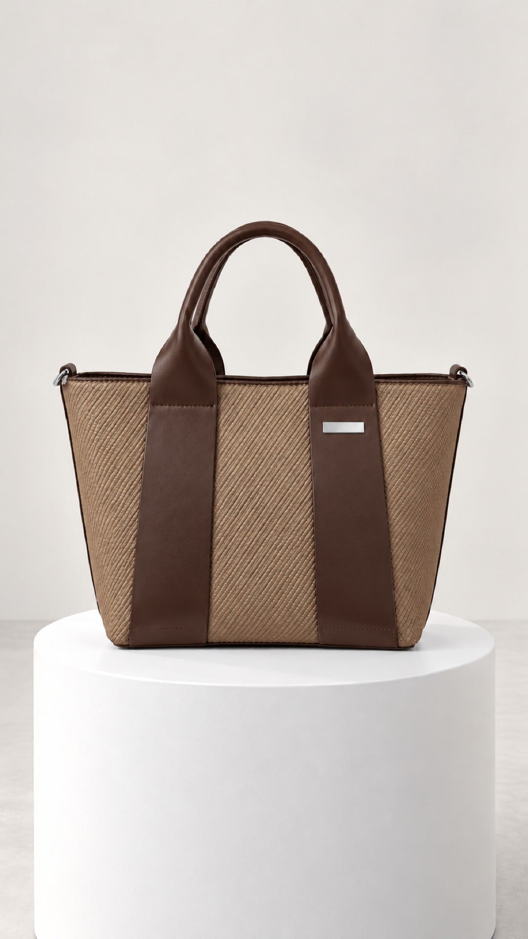 Reem Top-Handle Bag in brown, tan body with dark brown panels, front view